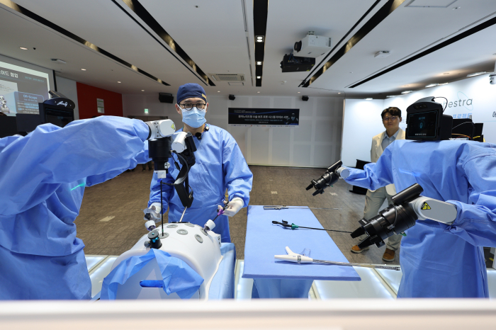Two humanoids passed tools in a Seoul operating room. They did not operate.